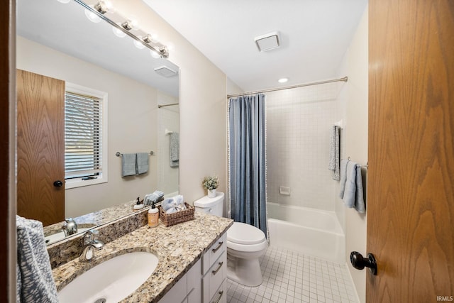 bathroom featuring toilet, shower / bath combo, vanity, and tile patterned floors