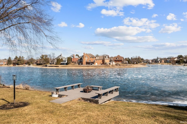 dock area featuring a yard, a water view, and a residential view