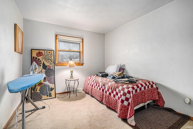 carpeted bedroom with baseboards