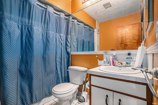 full bathroom featuring a shower with shower curtain, toilet, a textured ceiling, vanity, and tile patterned floors