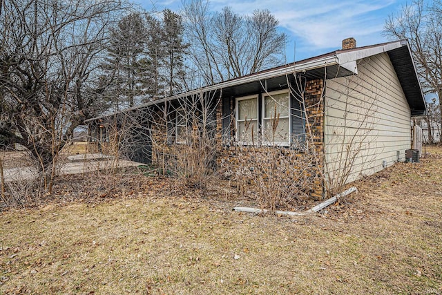 view of side of property with a chimney