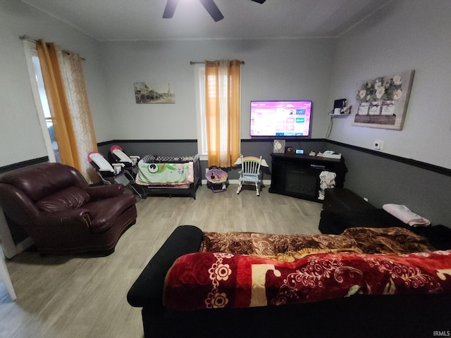 living room featuring ceiling fan and wood finished floors