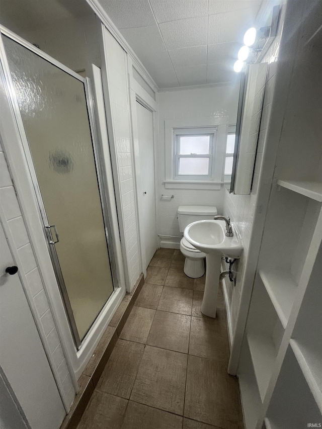 full bath with toilet and a shower stall