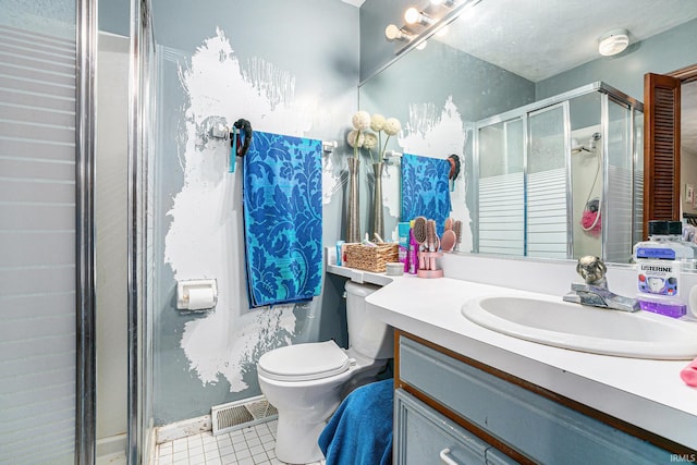 full bathroom featuring toilet, a stall shower, vanity, and visible vents