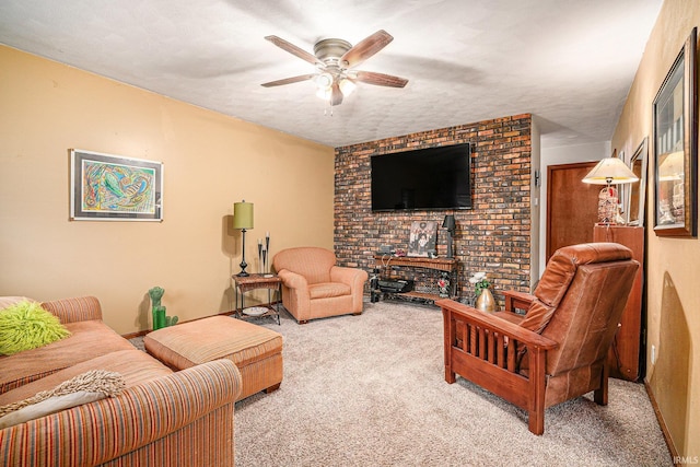 living area with carpet floors, ceiling fan, and a textured ceiling