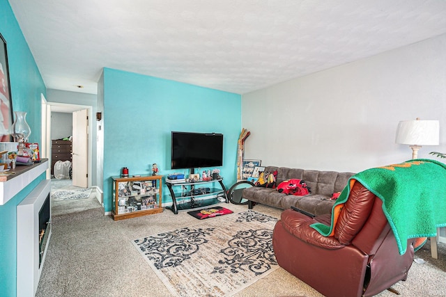 carpeted living area with a textured ceiling