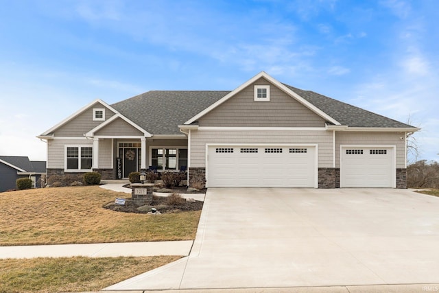 craftsman inspired home featuring a garage, stone siding, roof with shingles, and driveway