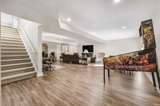 living room with stairs, baseboards, wood finished floors, and recessed lighting