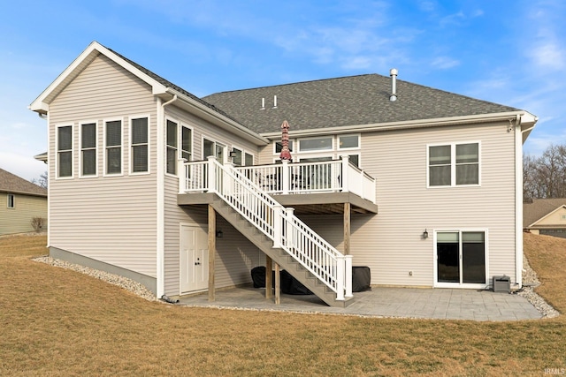 back of property with a yard, a patio, a deck, and stairs