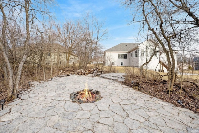 view of yard with a patio area and a fire pit