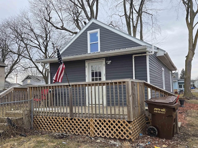 back of property with a wooden deck