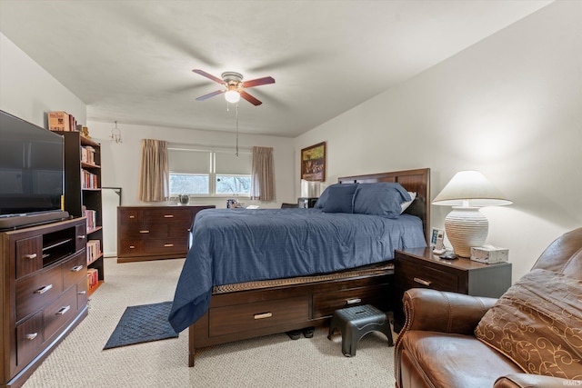 bedroom with ceiling fan and light colored carpet