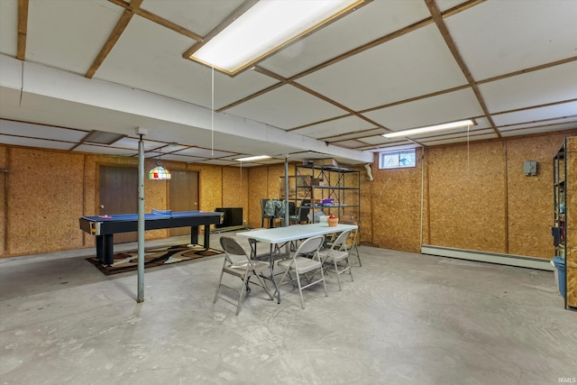 recreation room with billiards, baseboard heating, and unfinished concrete floors