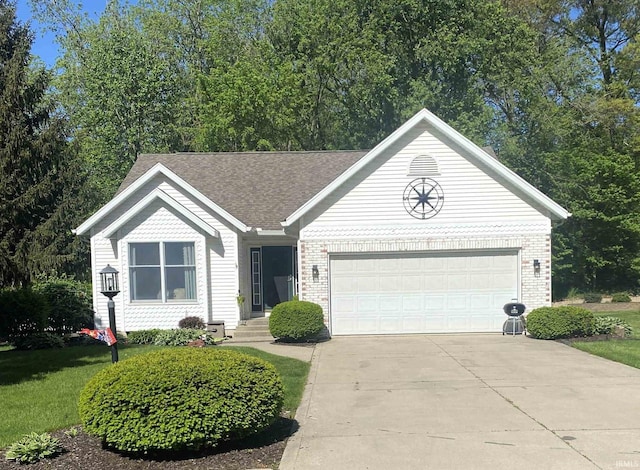 ranch-style home with a garage, driveway, and brick siding