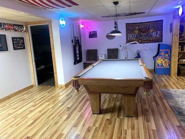 game room with baseboards, a drop ceiling, wood finished floors, and pool table