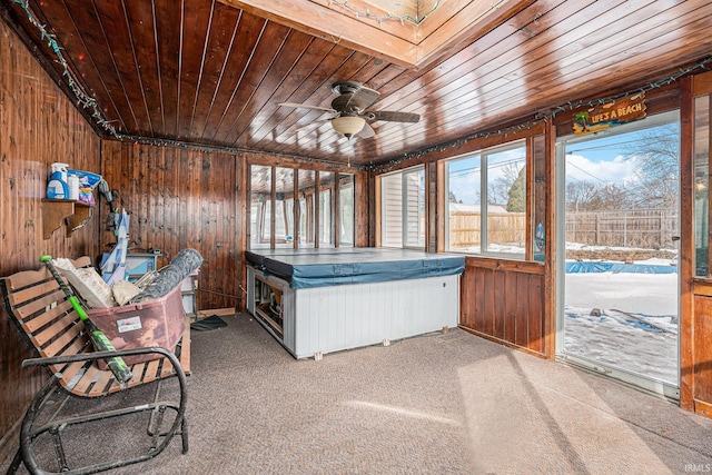 sunroom / solarium with wooden ceiling and ceiling fan