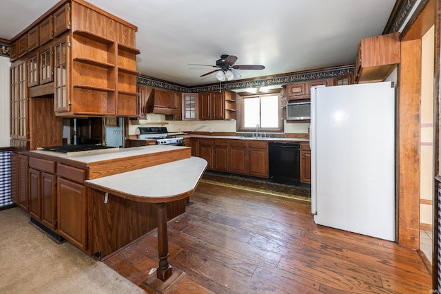 kitchen featuring range with gas stovetop, open shelves, freestanding refrigerator, dishwasher, and a peninsula