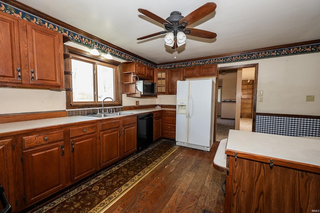 kitchen with black dishwasher, white refrigerator with ice dispenser, dark wood finished floors, stainless steel microwave, and a sink