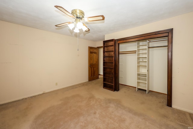 unfurnished bedroom featuring ceiling fan, carpet floors, a closet, and baseboards