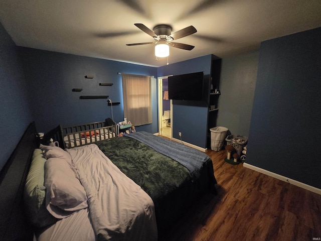 bedroom featuring wood finished floors, a ceiling fan, and baseboards