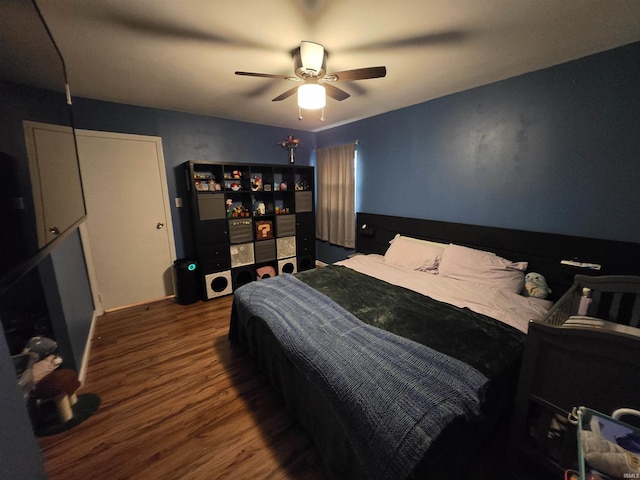 bedroom with a ceiling fan and wood finished floors