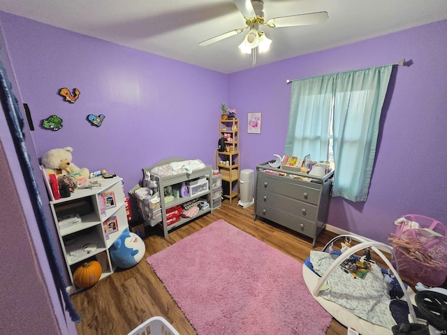 bedroom featuring wood finished floors and a ceiling fan