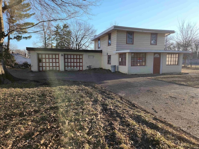 view of front of house featuring driveway and a garage