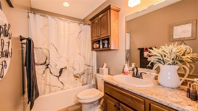 bathroom featuring toilet, vanity, and shower / bathtub combination with curtain