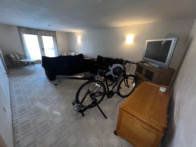 living room featuring a textured ceiling, carpet floors, and visible vents