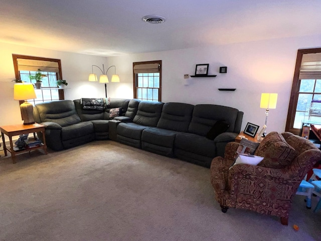 living room featuring carpet flooring and visible vents