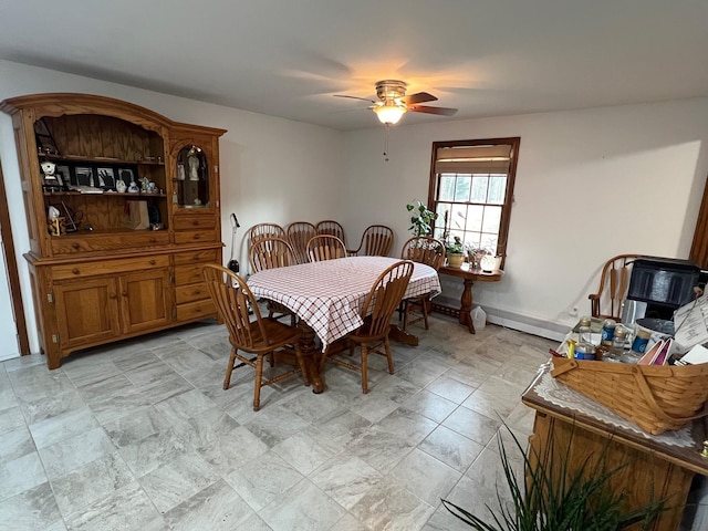 dining room featuring baseboards and a ceiling fan