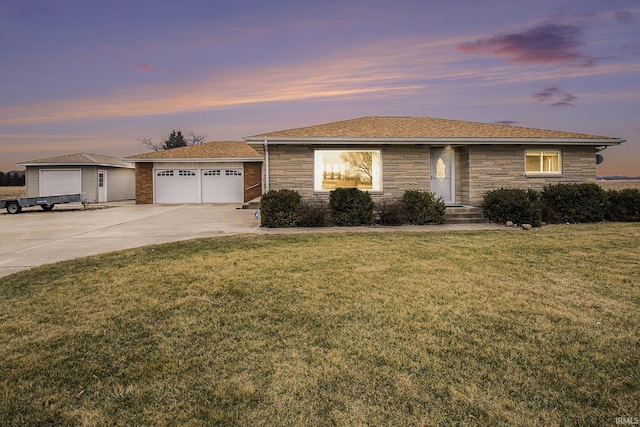 single story home featuring stone siding, a yard, and an outdoor structure