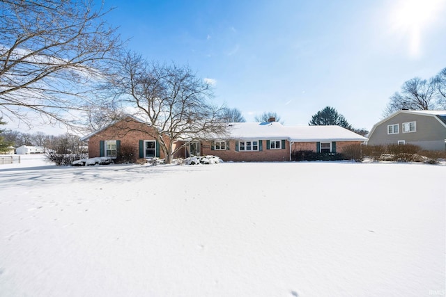 view of front of property featuring brick siding