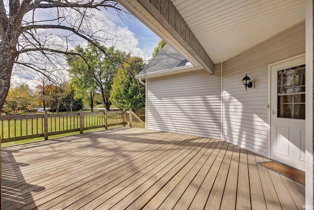 wooden deck with a yard