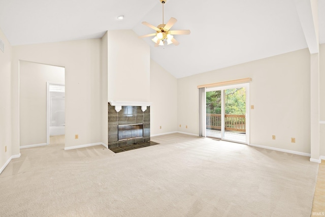 unfurnished living room featuring high vaulted ceiling, baseboards, carpet flooring, and a tiled fireplace