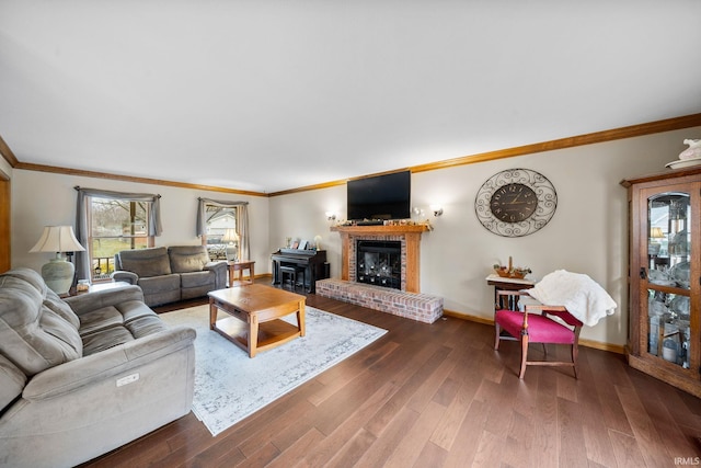 living room featuring ornamental molding, a brick fireplace, dark wood-style flooring, and baseboards