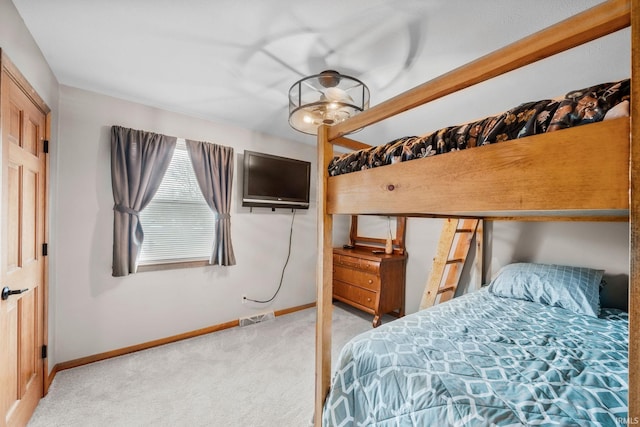 bedroom featuring carpet flooring, visible vents, and baseboards