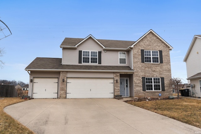 traditional home with driveway and brick siding