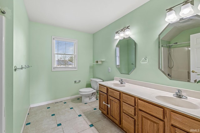 bathroom with a shower, tile patterned flooring, a sink, and toilet