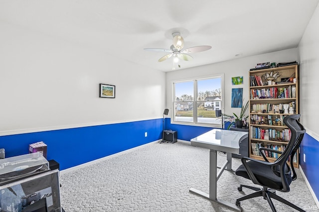 home office with ceiling fan, baseboards, and carpet flooring