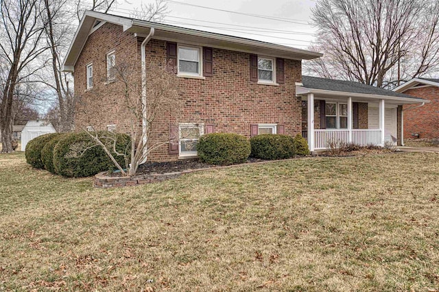 view of home's exterior featuring covered porch, brick siding, and a lawn