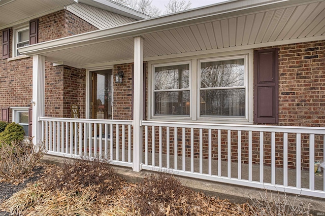 view of side of property featuring brick siding