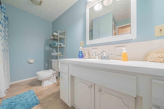 bathroom with tile patterned flooring, toilet, visible vents, vanity, and decorative backsplash