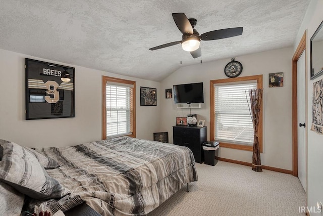 bedroom featuring lofted ceiling, a ceiling fan, light carpet, a textured ceiling, and baseboards