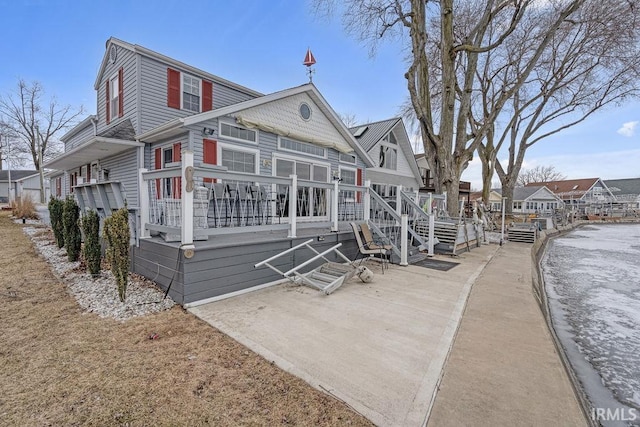 view of front of property with a residential view and a deck