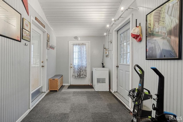 doorway featuring baseboards