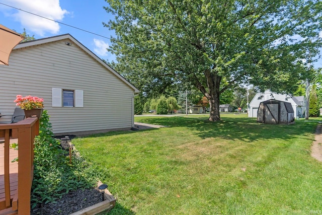 view of yard featuring a shed and an outbuilding