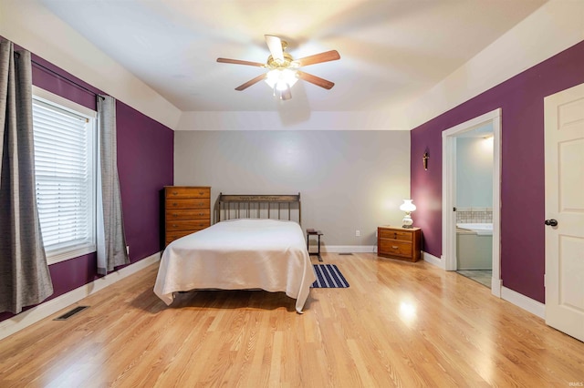 bedroom with light wood-type flooring, baseboards, visible vents, and ceiling fan