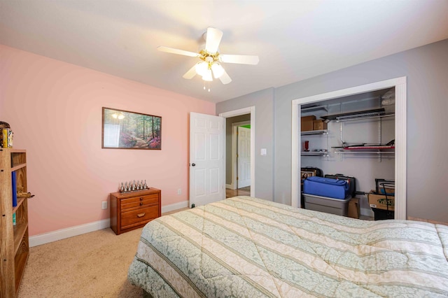 bedroom with carpet floors, ceiling fan, baseboards, and a closet