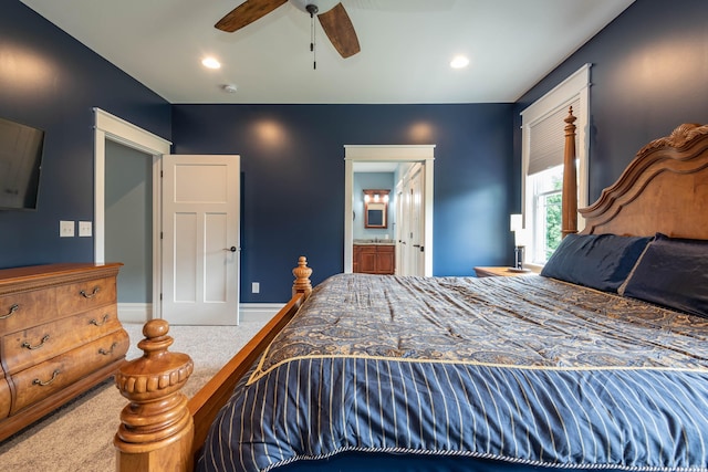 carpeted bedroom with recessed lighting, ceiling fan, baseboards, and ensuite bathroom